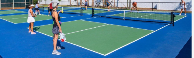 People playing pickleball on a clean court